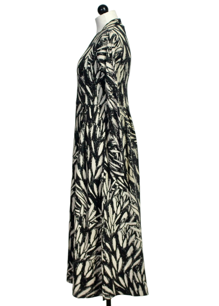 Side view of The Eba GOTS Dress by SKFK in the Leaves Print