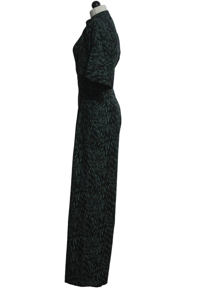 side view of The Siloe Jumpsuit by SKFK in the green Leaves print