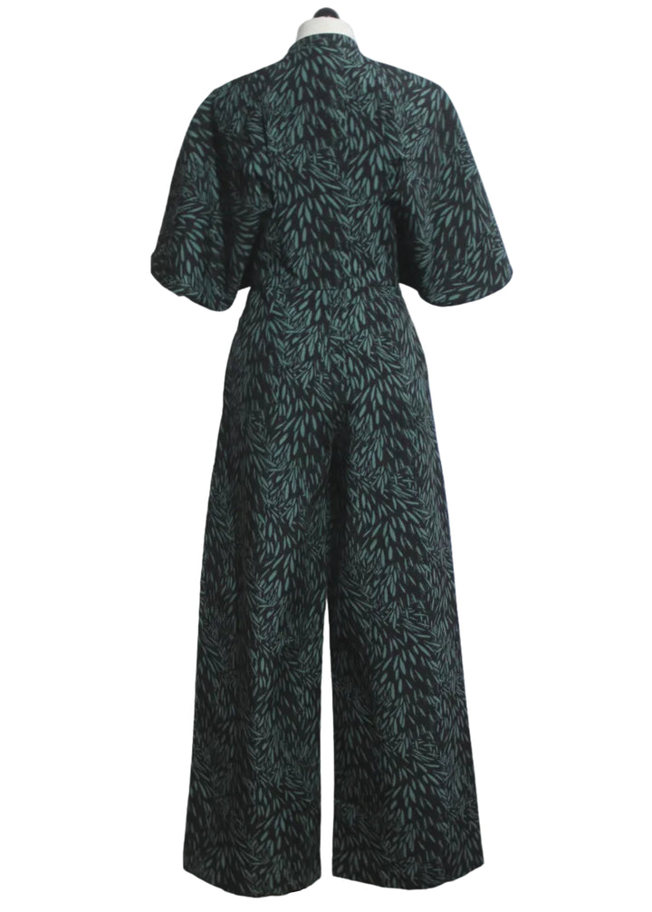 back view of The Siloe Jumpsuit by SKFK in the green Leaves print