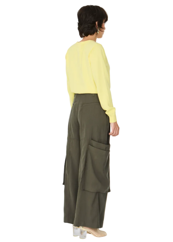 back view of a model wearing The Taupe Aines Trouser by SKFK