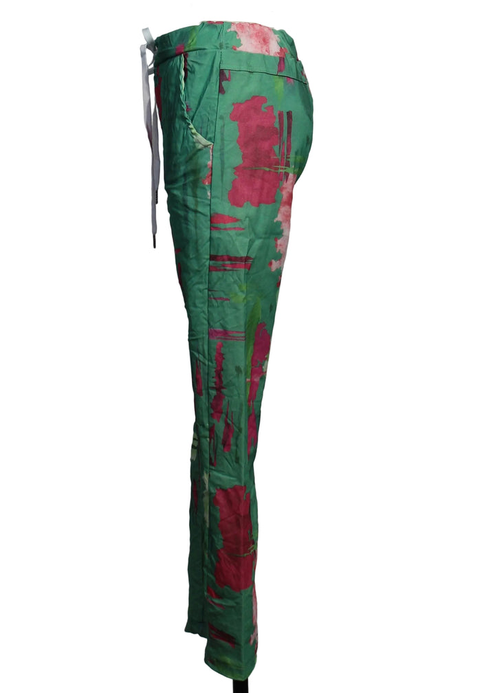 side view of Crinkled Drawstring Pant in a Pink and Green Abstract Parrot Print by Amorosa