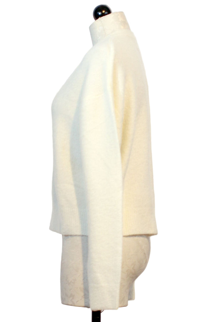 side view of Plush Snowdrop colored Zeta Lucia Easy V Neck Sweater by Colorush
