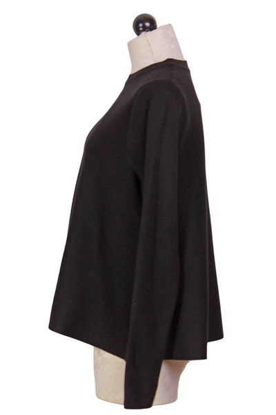 side view of black Cropped Flared Sweater by Compania Fantastica