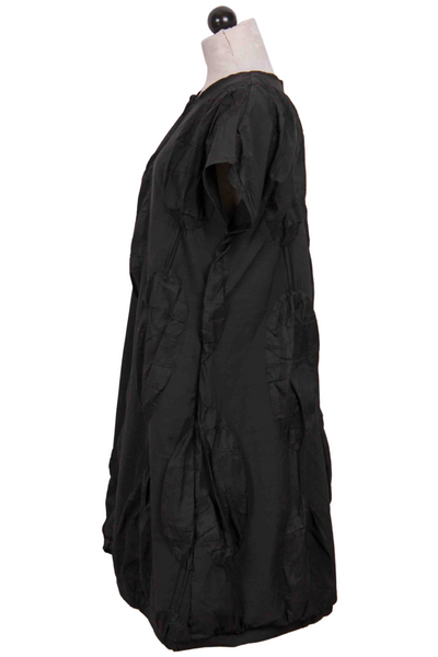 side view of black Simona Puffy Disc Dress by Kozan