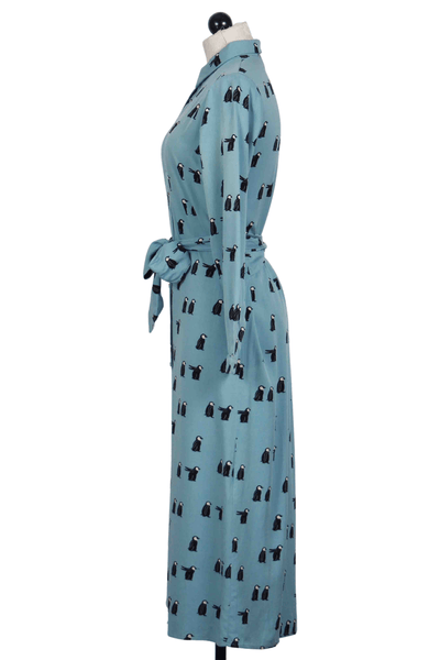 side view of Penguin Print Belted Midi Shirt Dress by Compania Fantastica
