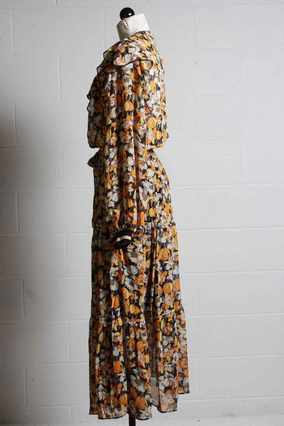 side view of floral ruffle front Midi Dress in gold colors by Summum Woman. 