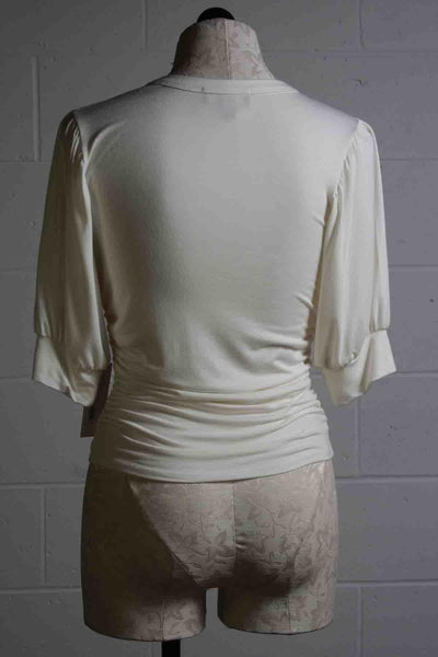 back view of cream Shirred Waist Puffed Sleeve Top by Fifteen Twenty