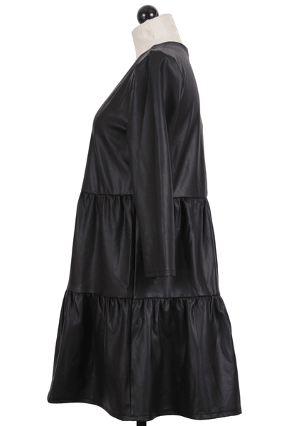 side view of Black Vegan Leather Tiered Dress by Isle by Megan Kozan