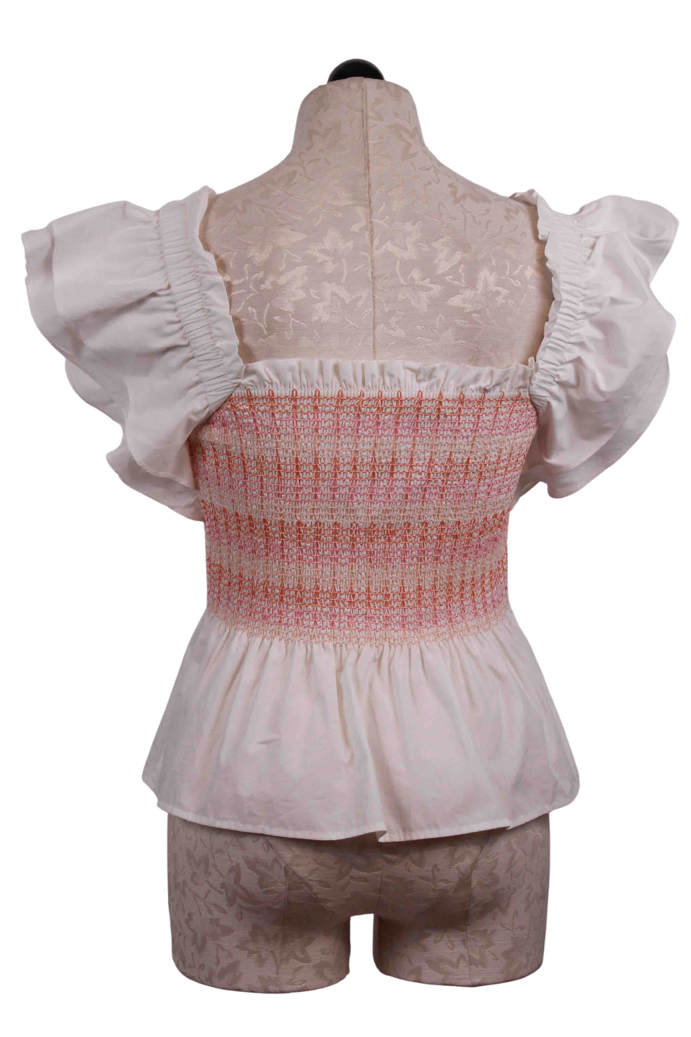 back view of Smocked, Ruffle Sleeve Winnie Top by Marie Oliver in Bellini