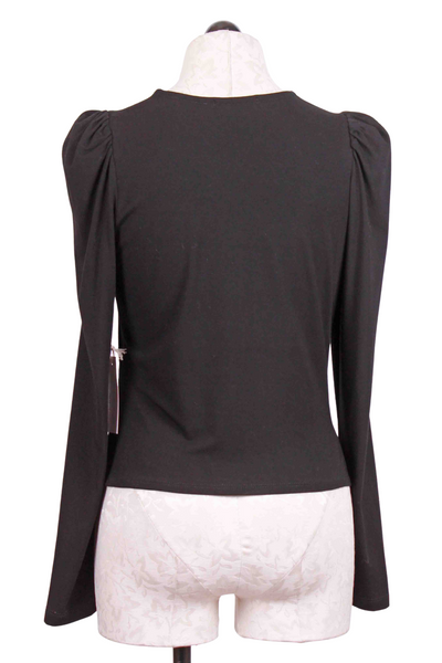 back view of Black Puff Sleeve Drape Front Top by Fifteen Twenty