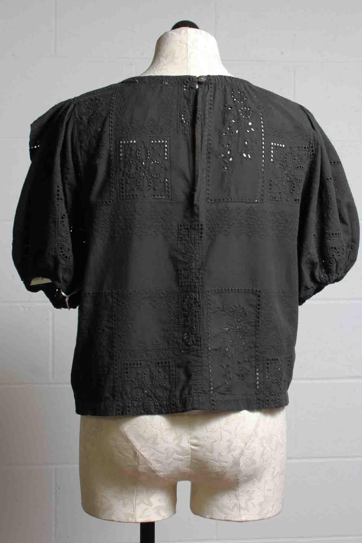 back view of Cotton Eyelet Embroidered Patchwork Carbon Blouse in Black by R.G. Kane with Puff Sleeves