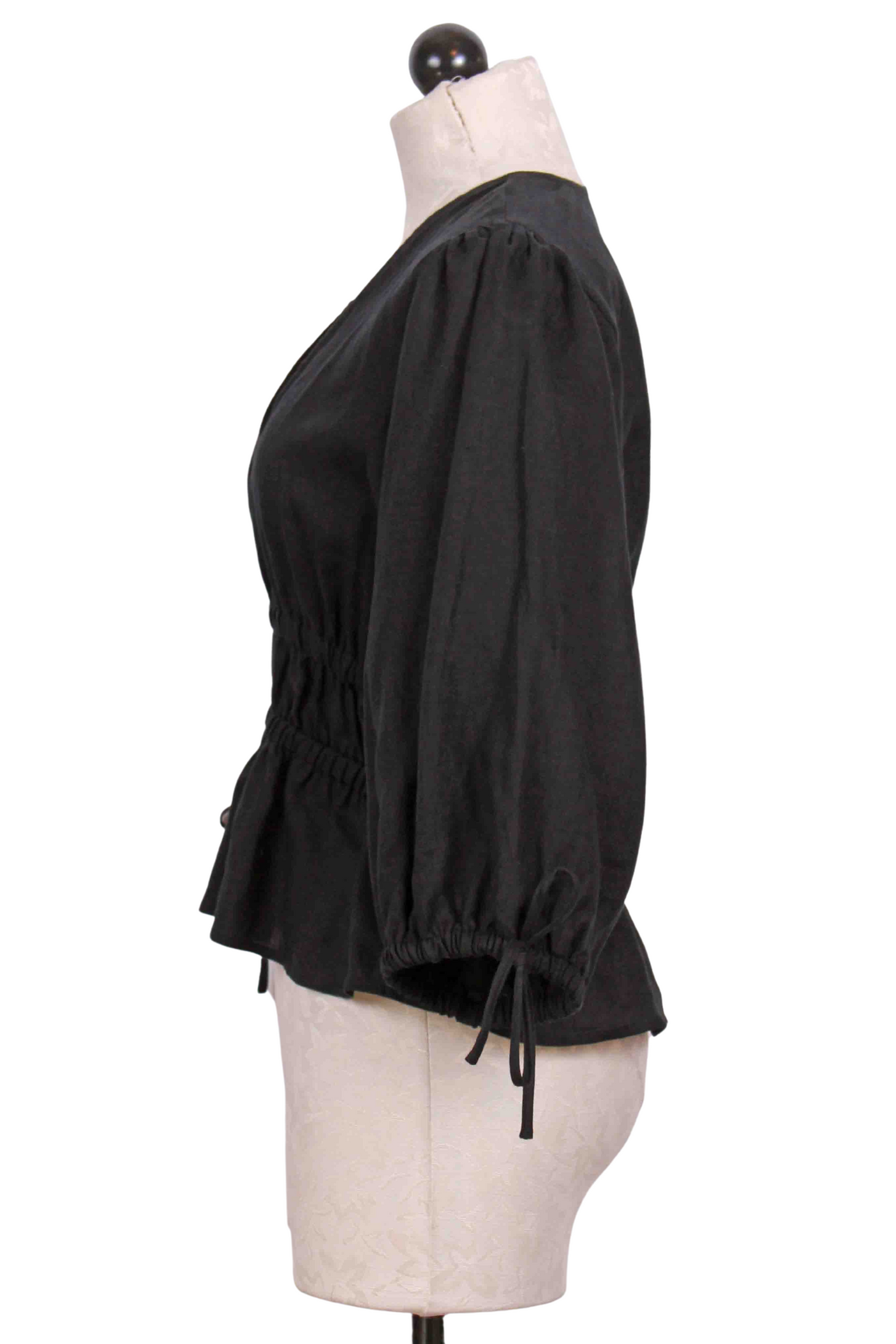 side view of black Linen Shirred Waist Top by Fifteen Twenty