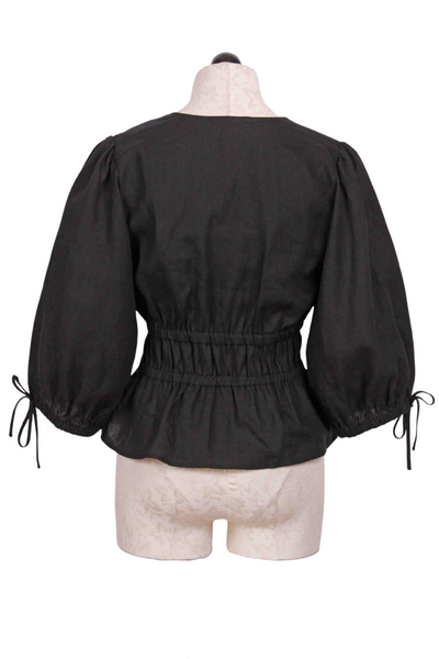 back view of black Linen Shirred Waist Top by Fifteen Twenty