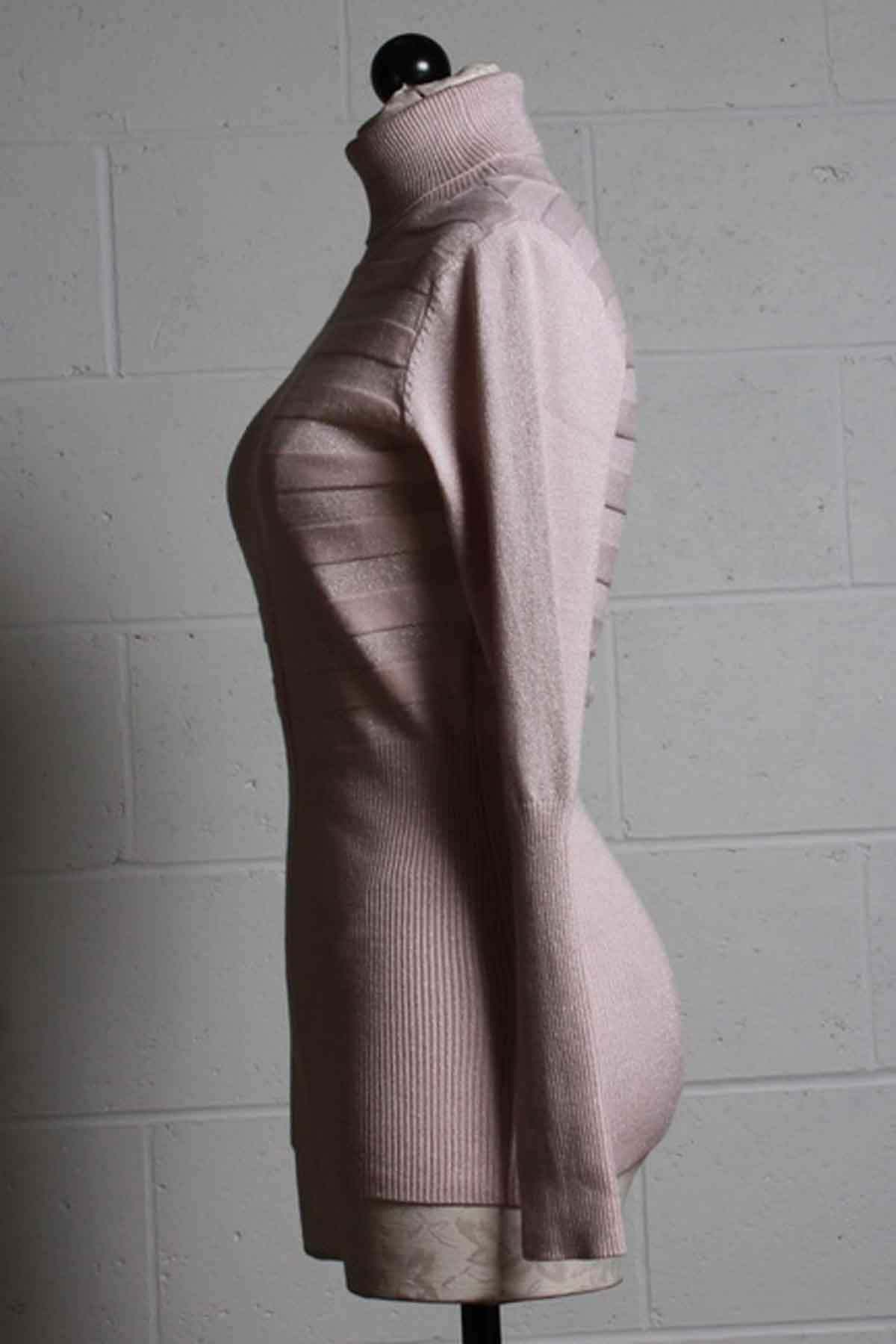 side view of blush Metallic Knit Turtleneck by Frank Lyman with a geometric woven texture
