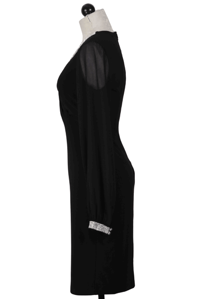 side view of Black Long Sleeve V Neck Dress by Frank Lyman with Rhinestone details