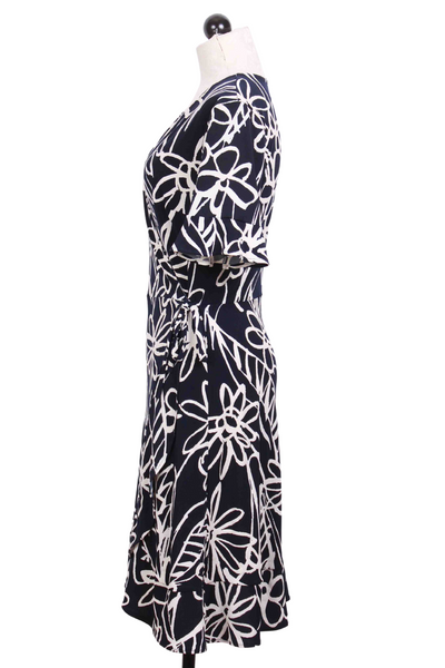 side view of navy and white Short Ruffle Sleeve faux wrap dress by Frank Lyman