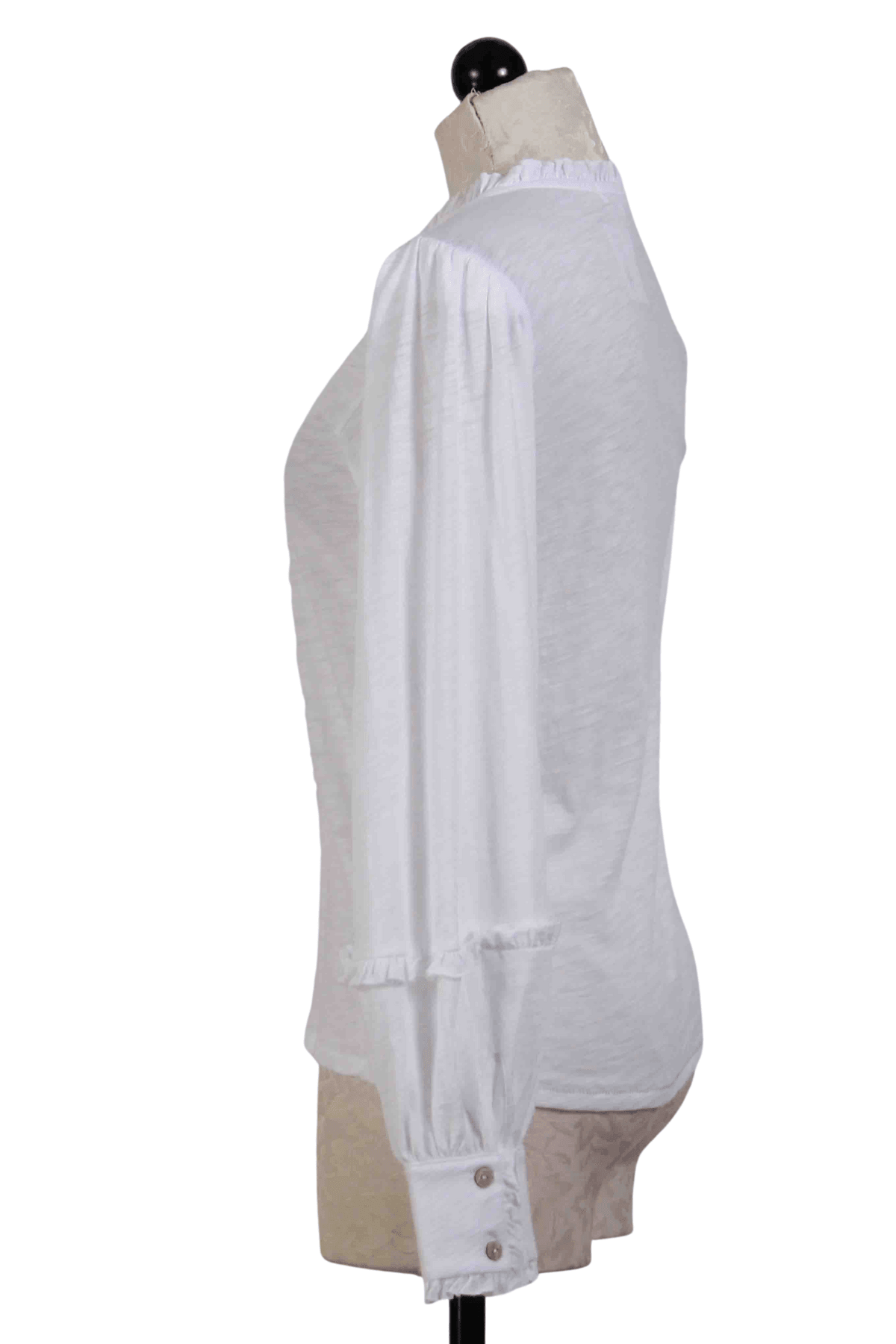 side view of white Long Sleeve Ruffle Crew Neck Tee by Goldie Tees with a Double Later Cuff