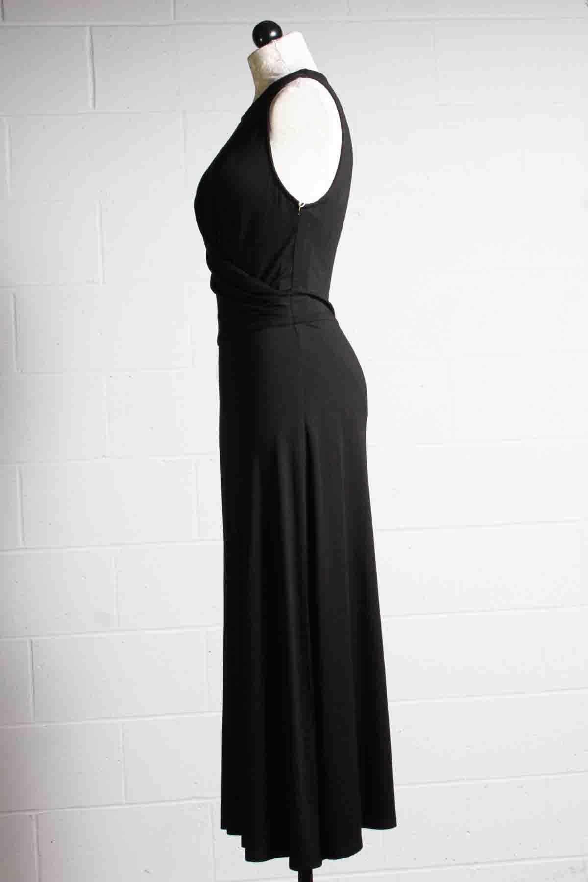 side view of Black Sleeveless Drape Front Midi Length Dress by Fifteen Twenty