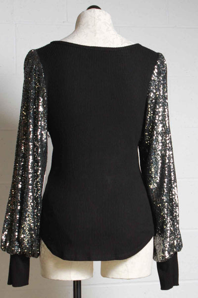 back view of black ribbed knit top by Fifteen Twenty with sequined blouson sleeves