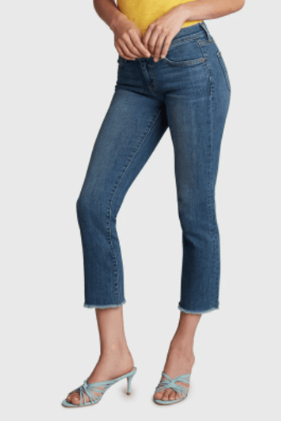 side view of cropped mid-rise jeans by Principle Denim in the Flyaway Medium Wash