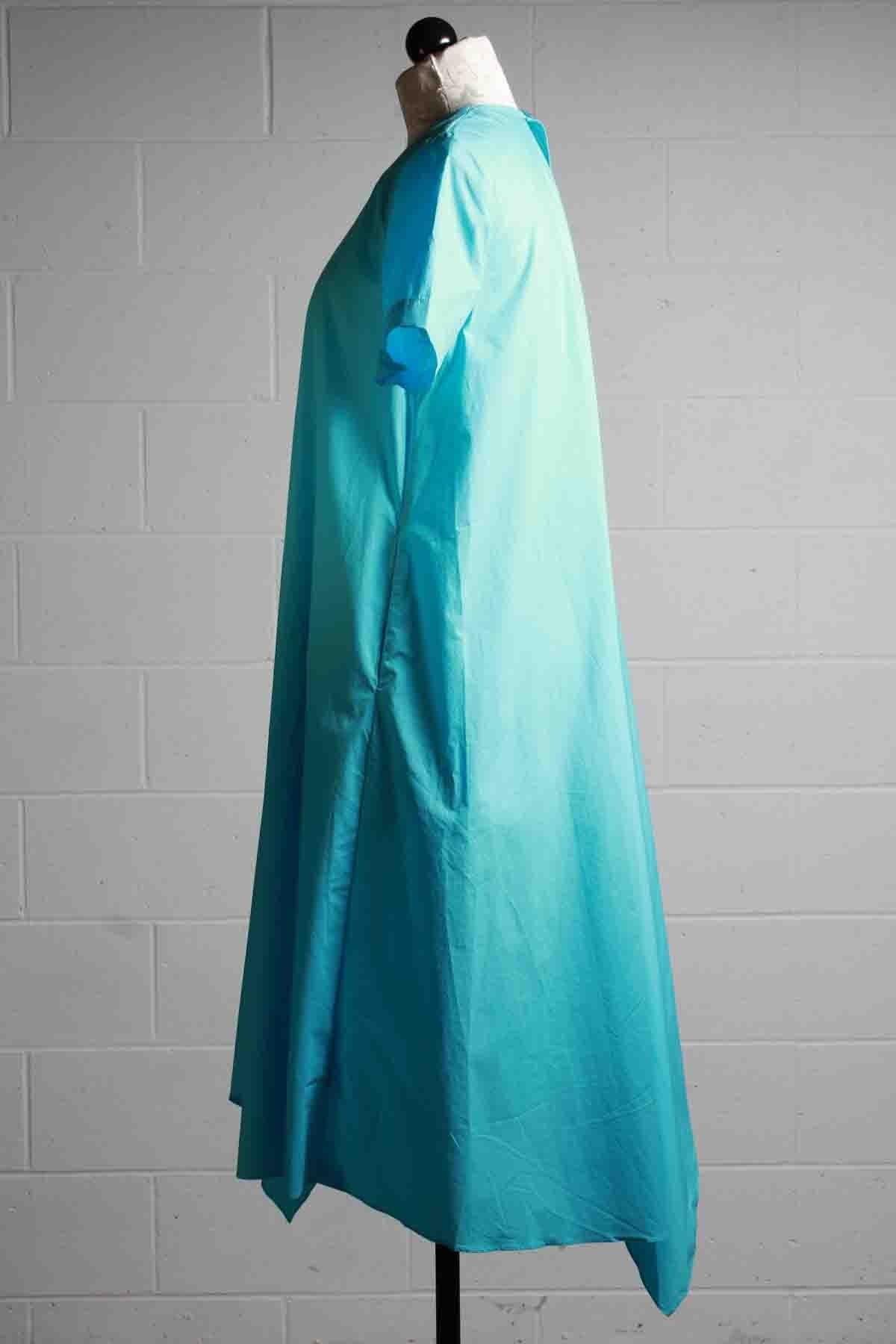side view of Cyan blue Short Sleeve Cotton Asymmetrical Hem Dress by JNBY