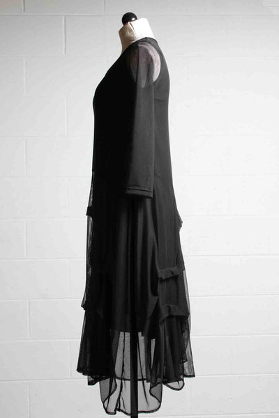 side view of black Lined Mesh Dress by Reina Lee with Ruched Skirt and Sheer 3/4 Sleeves