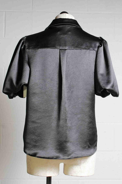 back view of Black Vintage Heavy Satin Short Puff Sleeve Button Down Top by Fifteen Twenty