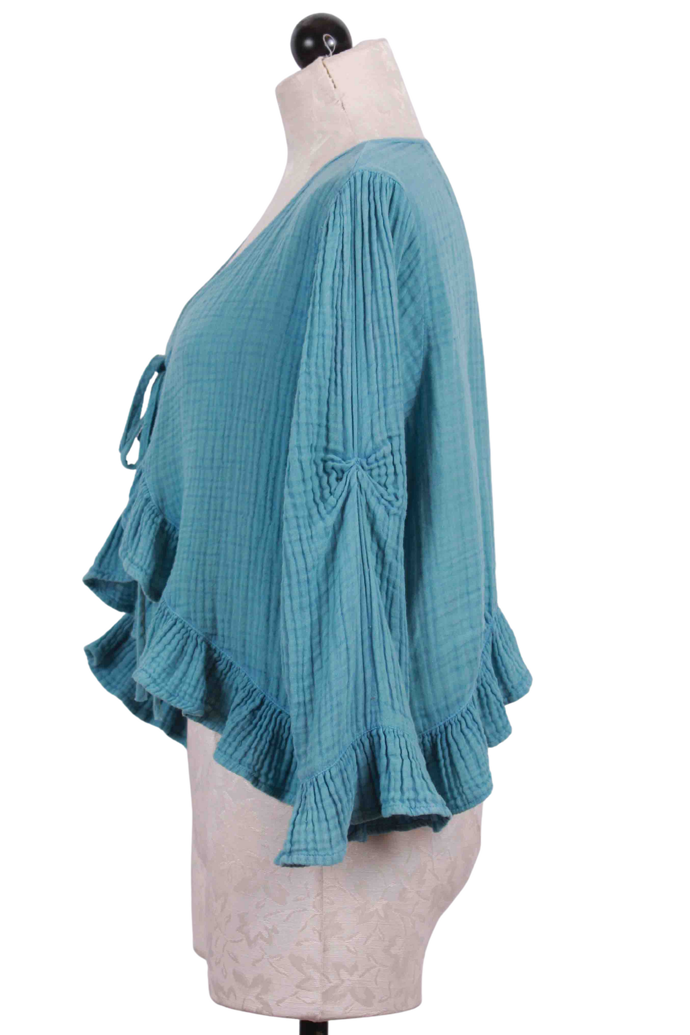 side view of blue Hi-Low Ruffle Cropped Jacket by Paper Lace