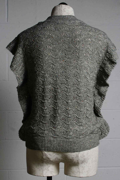 back view of sleeveless seafoam green pointelle sweater by Another Love with a ruffle down the sides and arms