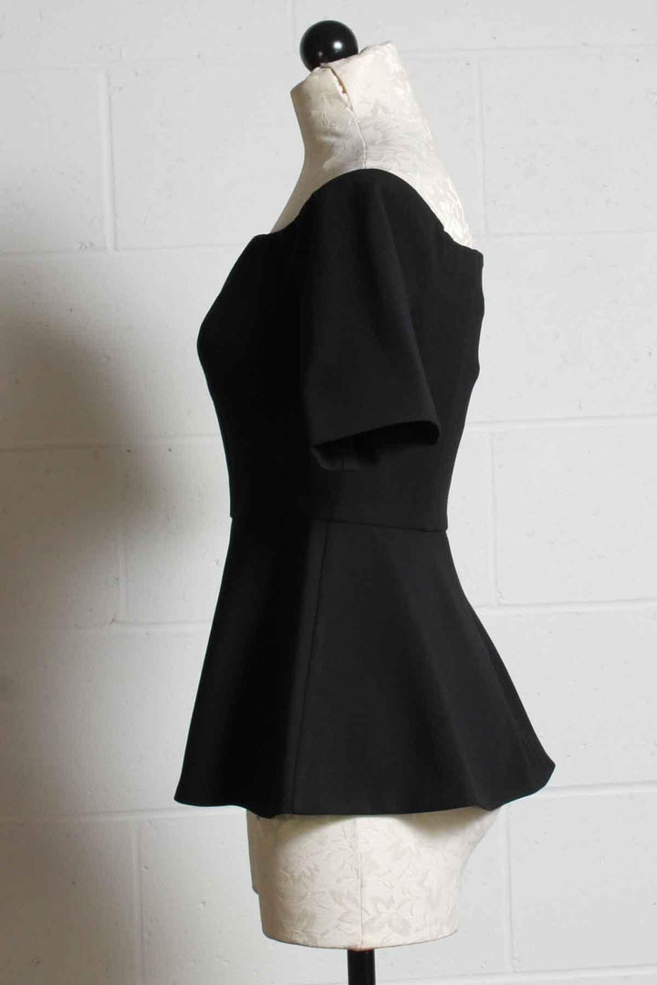 side view of black Elegant fitted Off the shoulder Forbid Top by Trina Turk with a peplum bottom