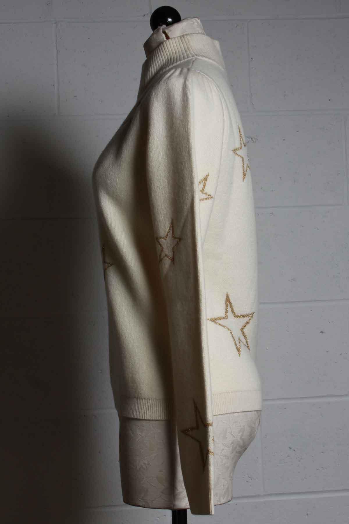 side view of Cream mock neck sweater by Generation Love with gold outlined stars 