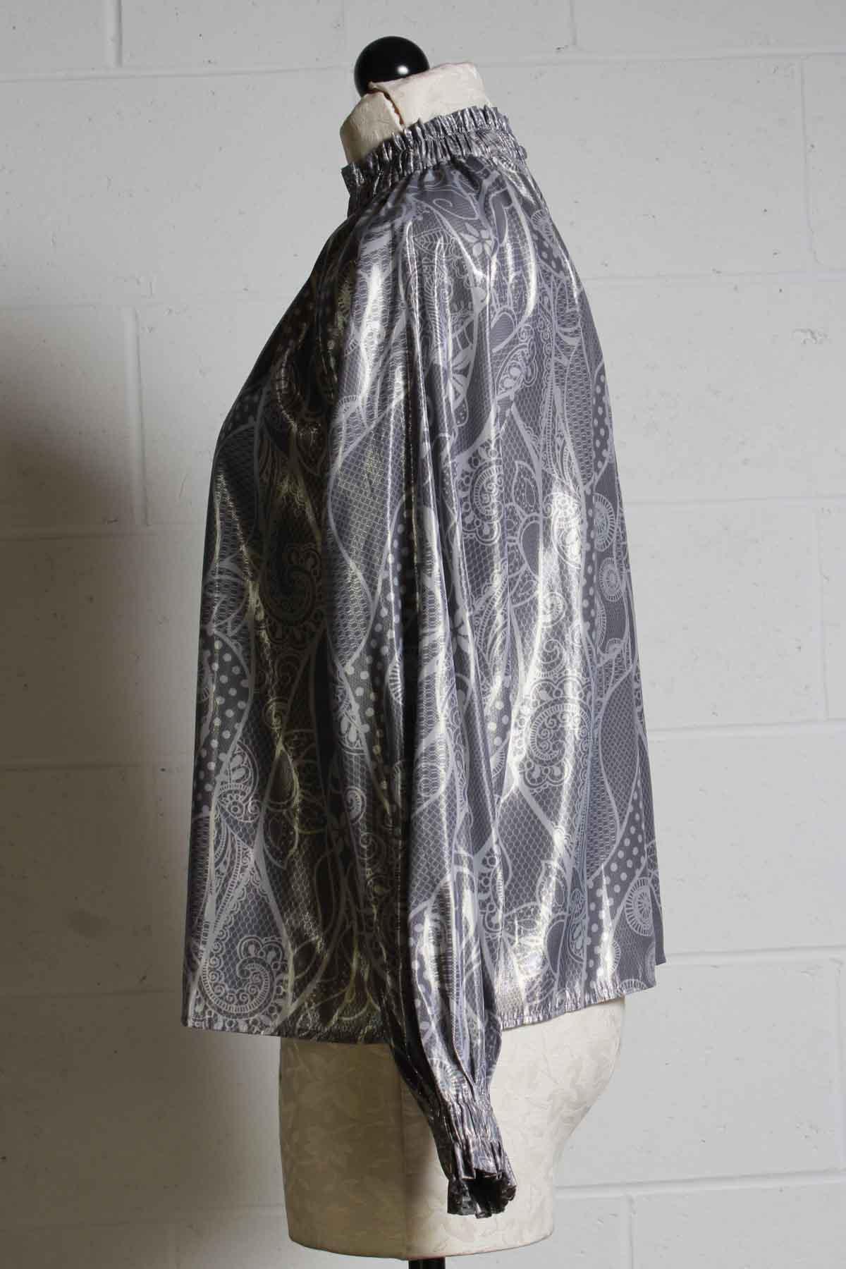 side view of high gathered elastic neckline top with elastic gathered cuffs in a silver with white print by Marie Oliver