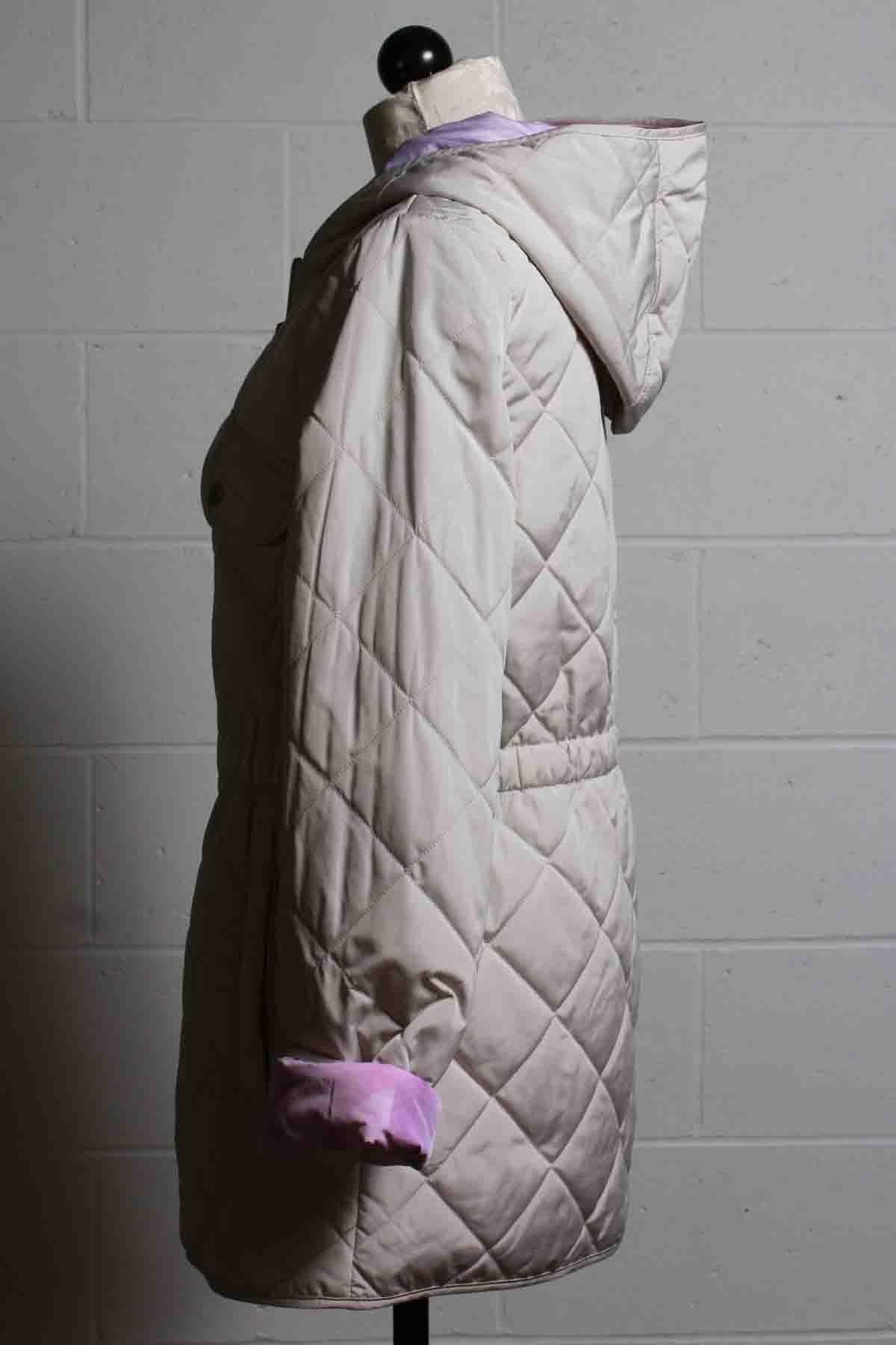side view of Sand colored Lisa Jacket from Nikki Jones that is Reversible to a lilac floral and Quilted