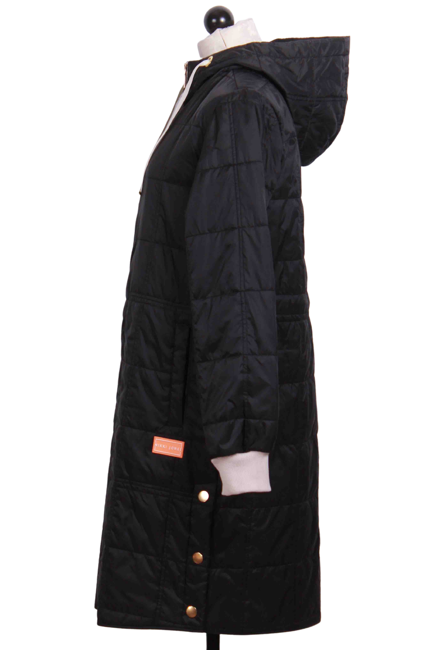 side view of Black Hooded Quilted Leonardo Coat by Nikki Jones