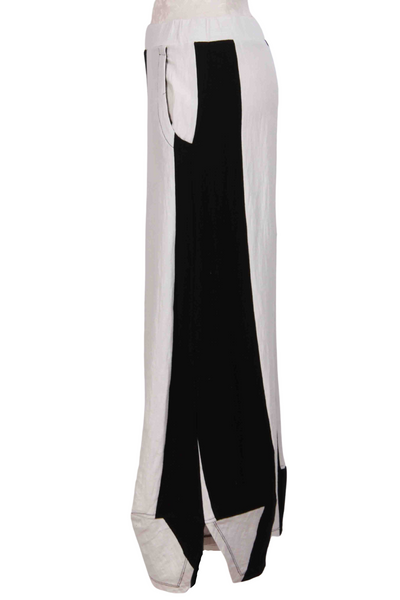 side view of Black and White Wide Vertical Striped Pant by Alembika