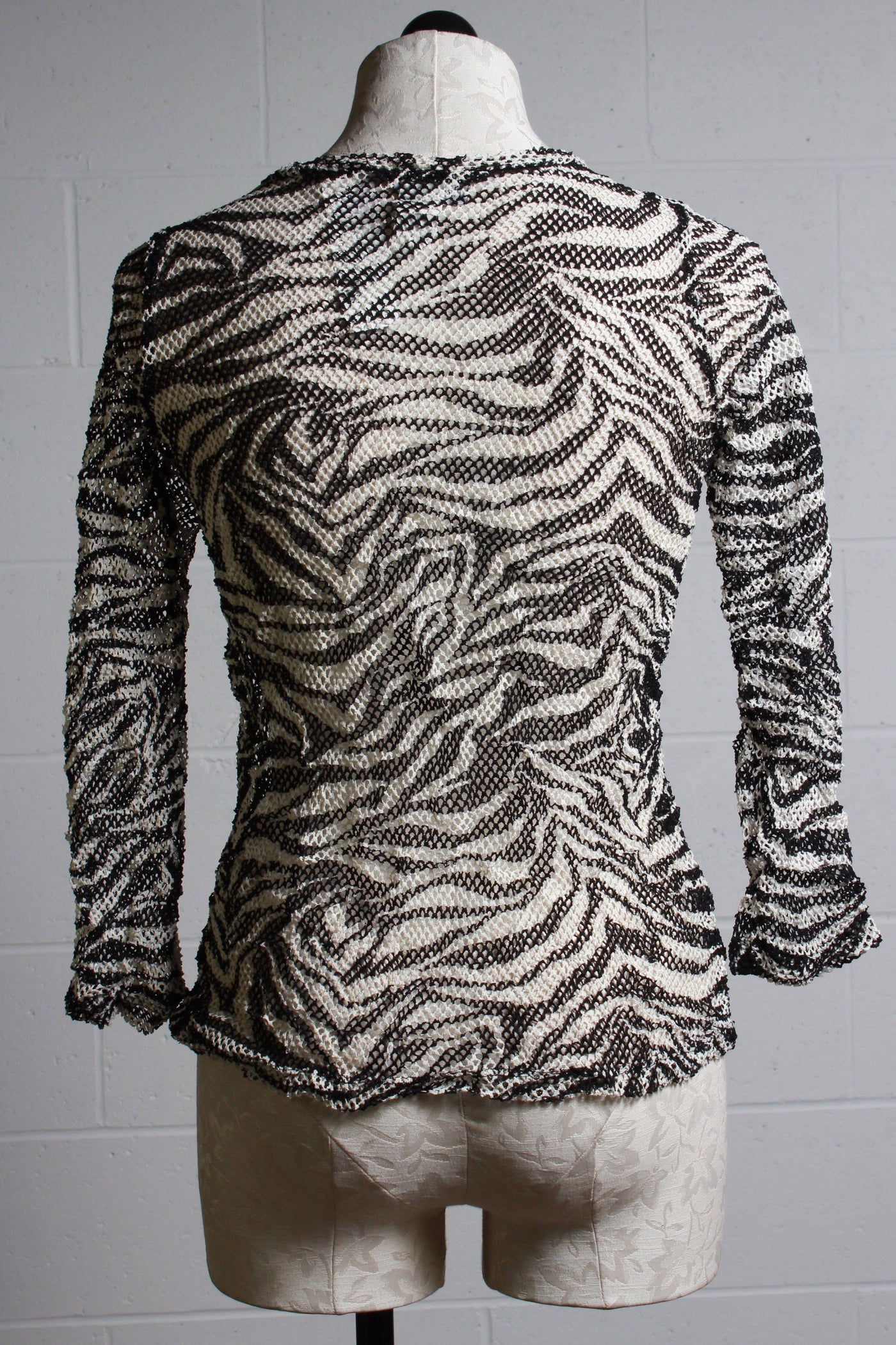 back view of black and white zebra print mesh tee shirt