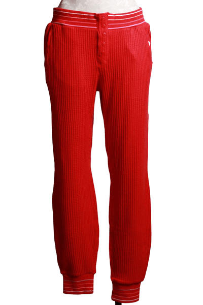 red ribbed thermal pant with a multi colored striped elastic waistband and ankle bands
