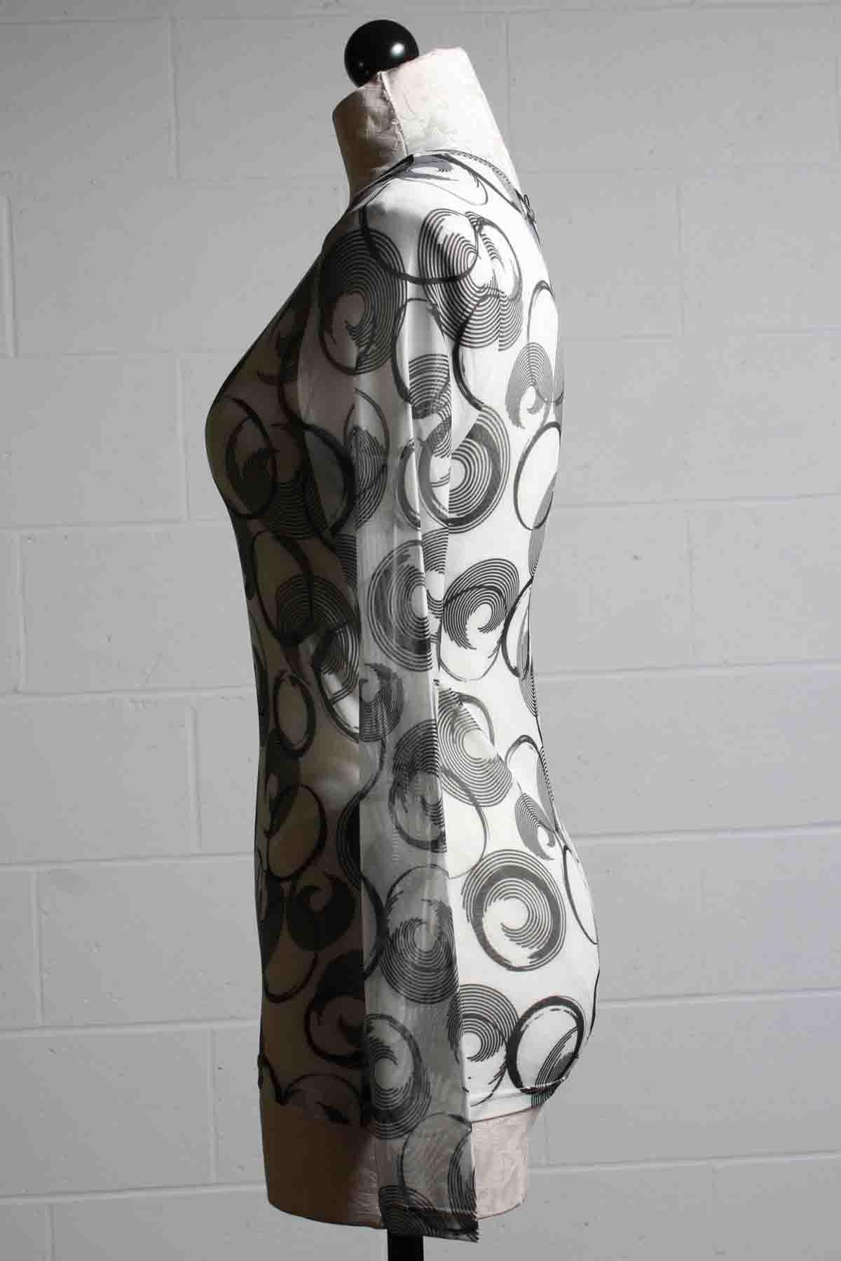 side view of White Sheer Mesh long sleeve Mika Top by Kozan with black circles and curls