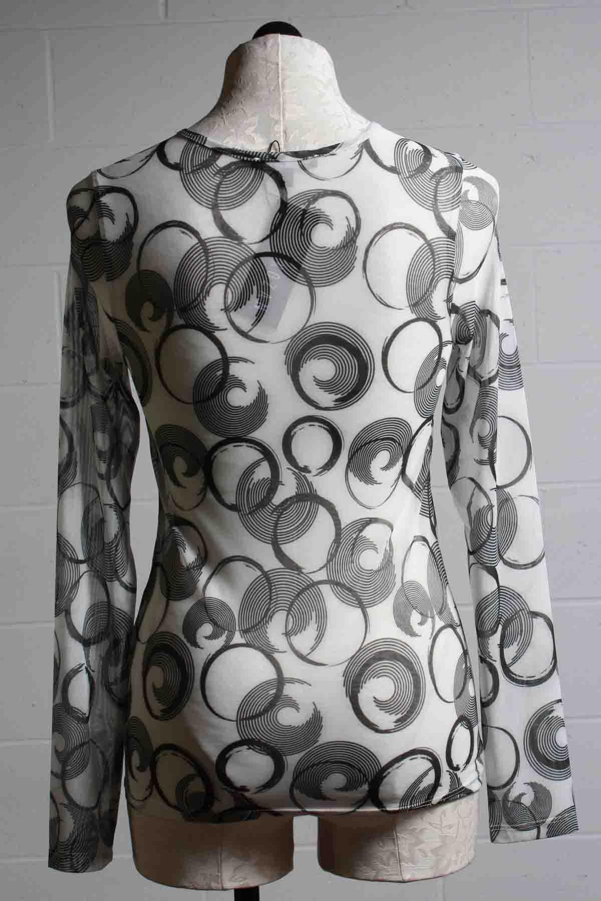 Back view of White Sheer Mesh long sleeve Mika Top by Kozan with black circles and curls