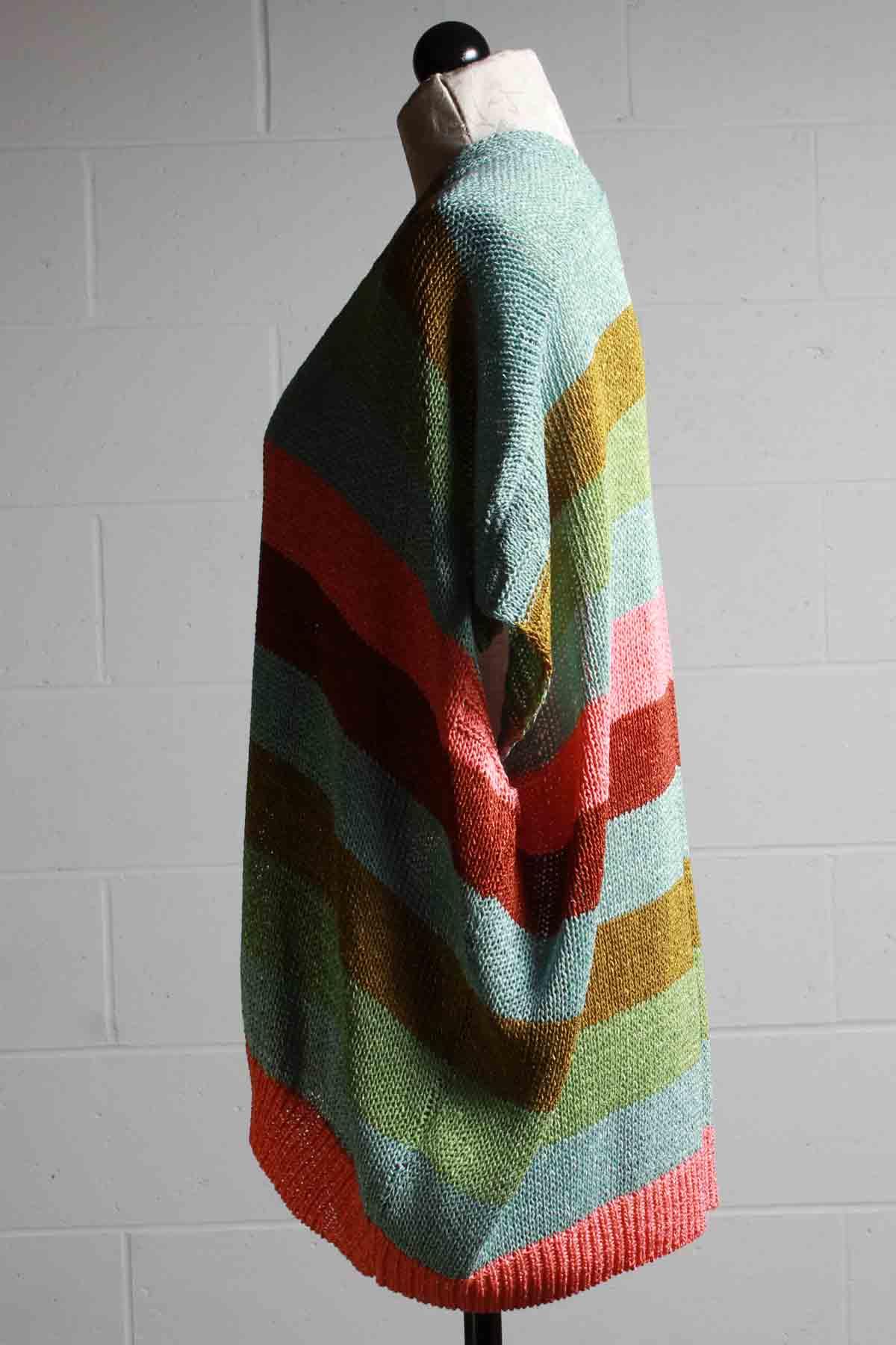 side view of Multi colored Horizon striped button front drop shoulder cardigan/poncho by Alembika