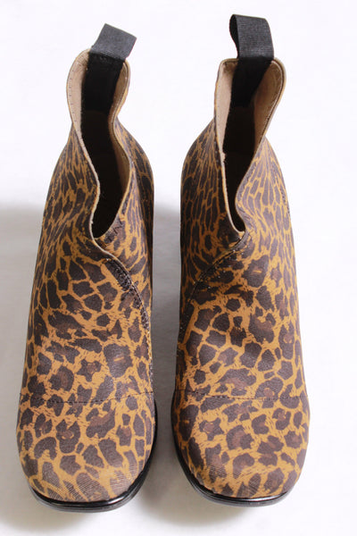 Front view of leopard slip on style bootie with a stacked 2" rubber bottom heel and a stretch elastic upper with a pull back tab