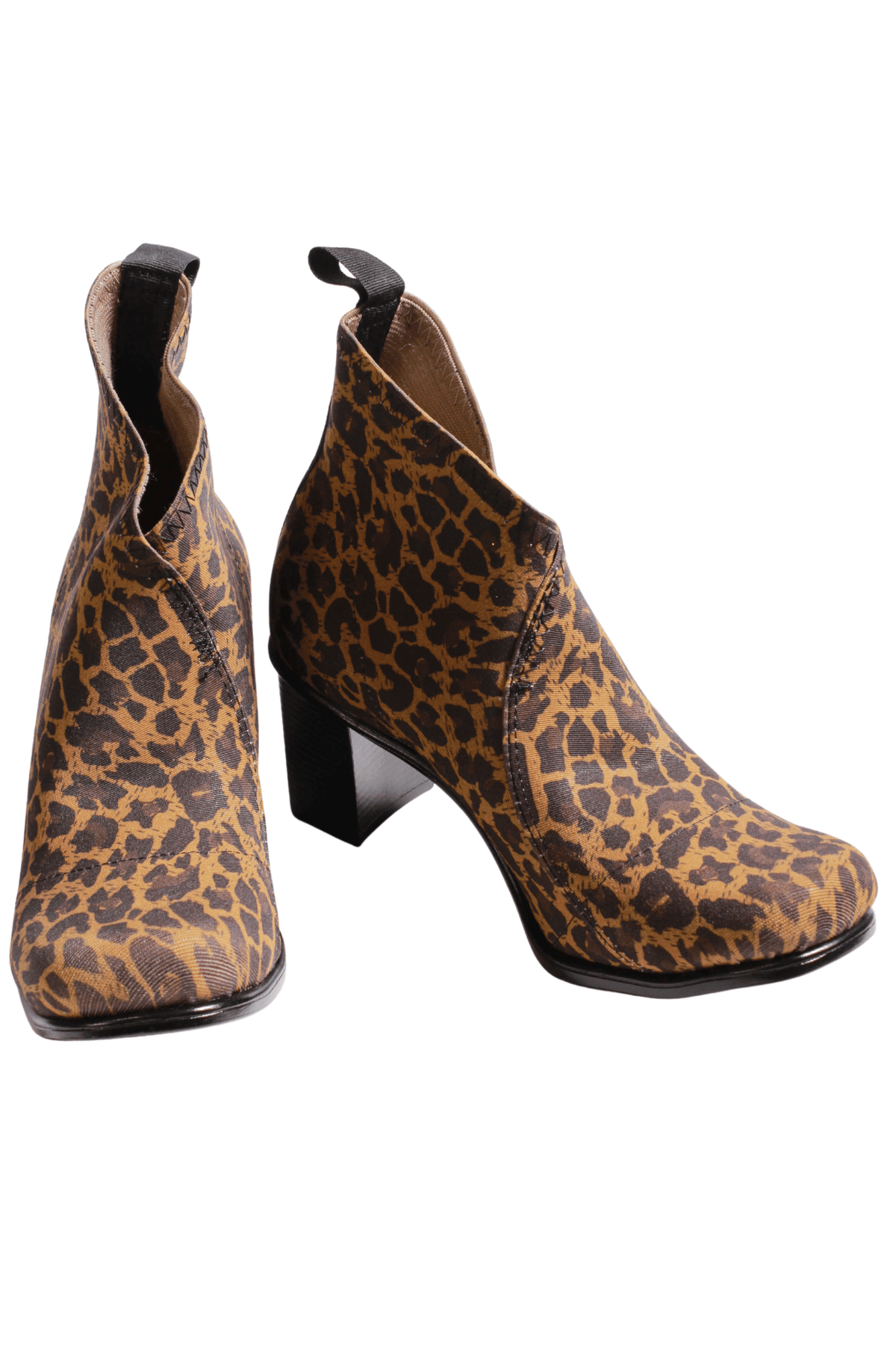 side view of leopard slip on style bootie with a stacked 2" rubber bottom heel and a stretch elastic upper with a pull back tab