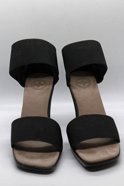 black cocktail sandal by Charleston Shoes with a 3 1/2" heel and a wide stretch upper toe band and ankle straps with a closed back