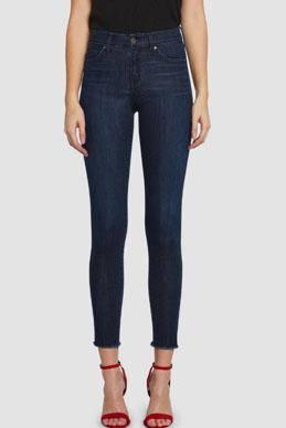 Dark clean wash High rise skinny cropped jeans by Principle Denim with slight frayed split hem.
