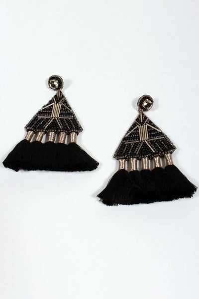 beaded triangle with 5 tassels of black yarn hanging off.